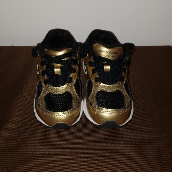 new balance gold and black